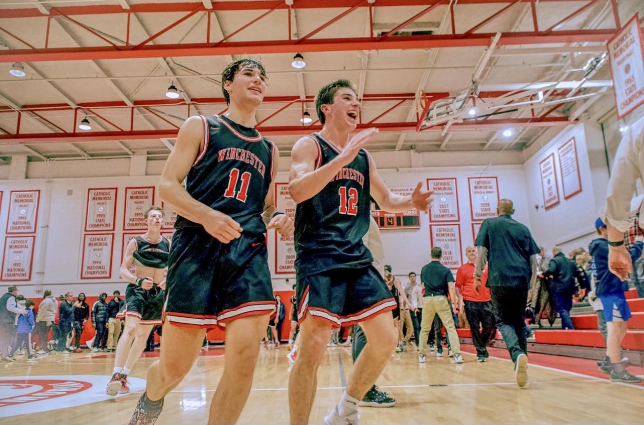 Dylan Ketterer and Tommy Lampert celebrate the Winchester Boys Varsity team's epic 61-55 upset of Catholic Memorial, the #1 team in MA (March 3, 2023)